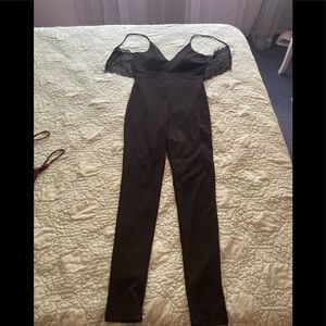 Black jumpsuit never worn still has tags.